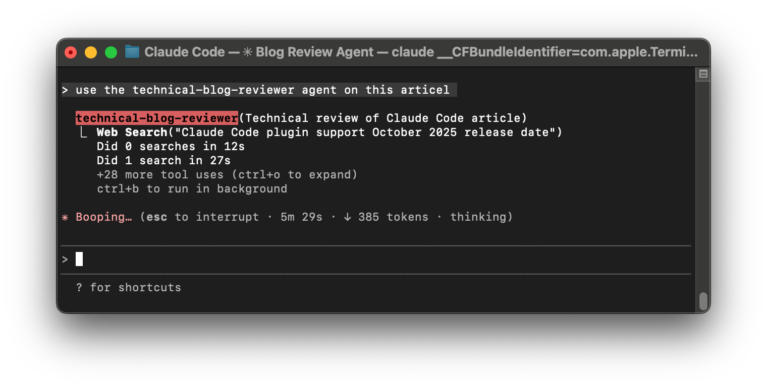 A screenshot of the technical-blog-reviewer sub-agent running in the background with the main Claude agent waiting for results.