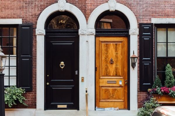 Two doors in the front of a building