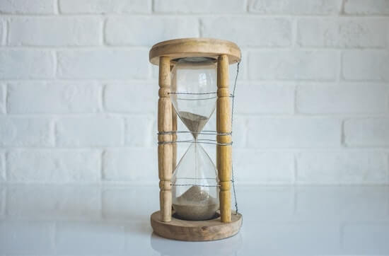 An hourglass with time running out.