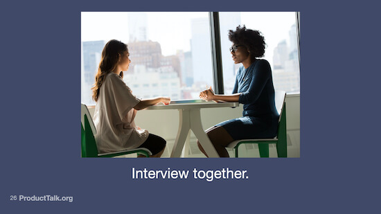 A photo of two women sitting at a table talking with the caption "Interview together."