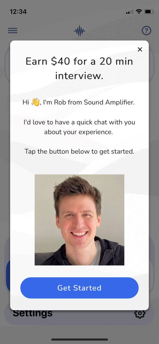 A screenshot of a pop-up in the Sound Amplifier app. There's a photo of Rob with text that reads, "Hi (waving hand emoji), I'm Rob from Sound Amplifier. I'd love to have a quick chat with you about your experience. Tap the button below to get started."