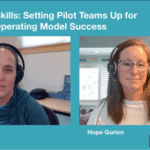 A video still of Teresa Torres and Hope Gurion discussing how to set pilot teams up for success in a product operating model transformation. Both are wearing headsets and appear side-by-side on a teal background with the title "Building Skills: Setting Pilot Teams Up for Product Operating Model Success" and the Product Talk logo.